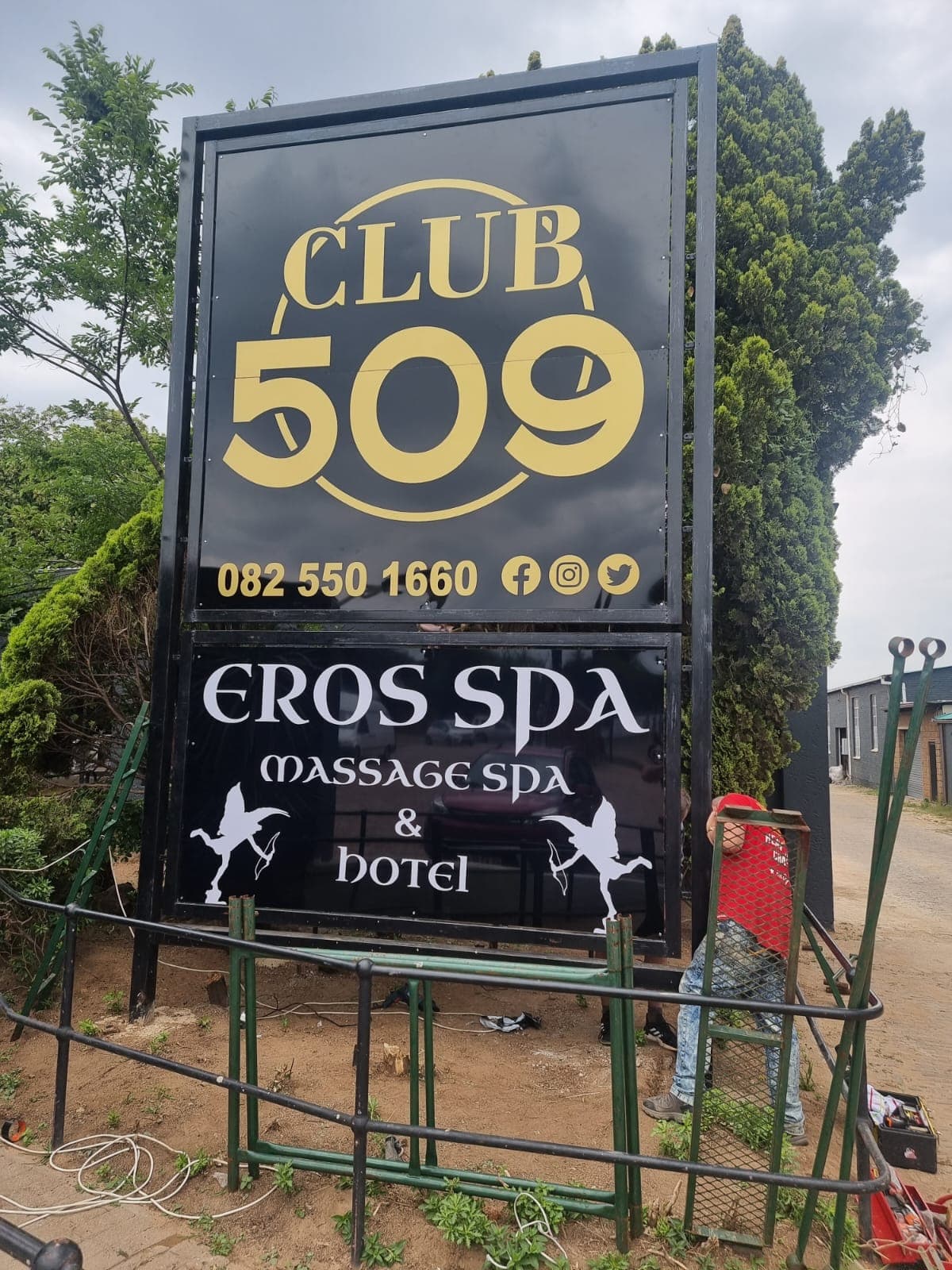 Black and gold Club 509 tower sign on a steel frame