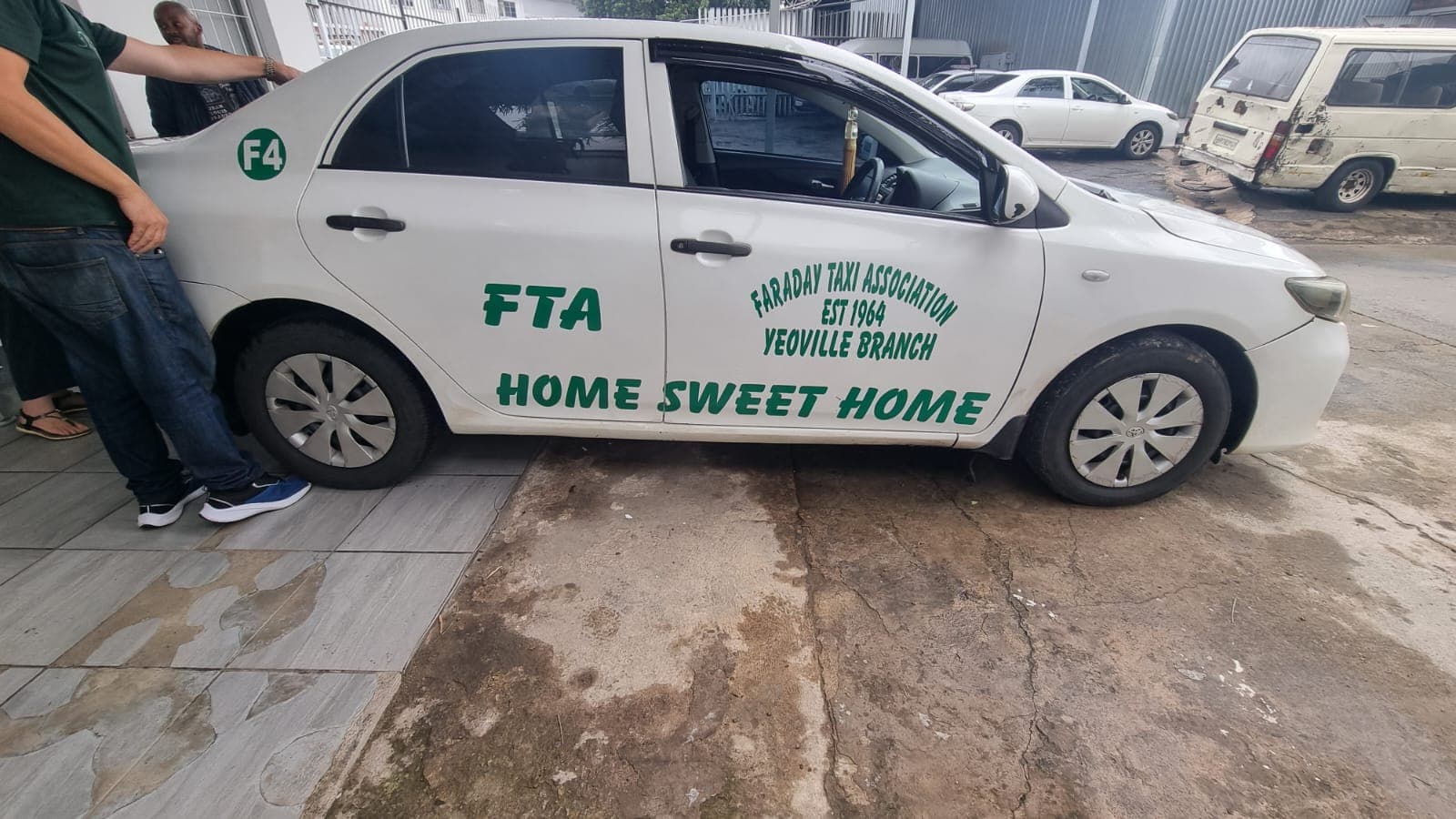 Minibus taxi with freshly applied company lettering along the side panels