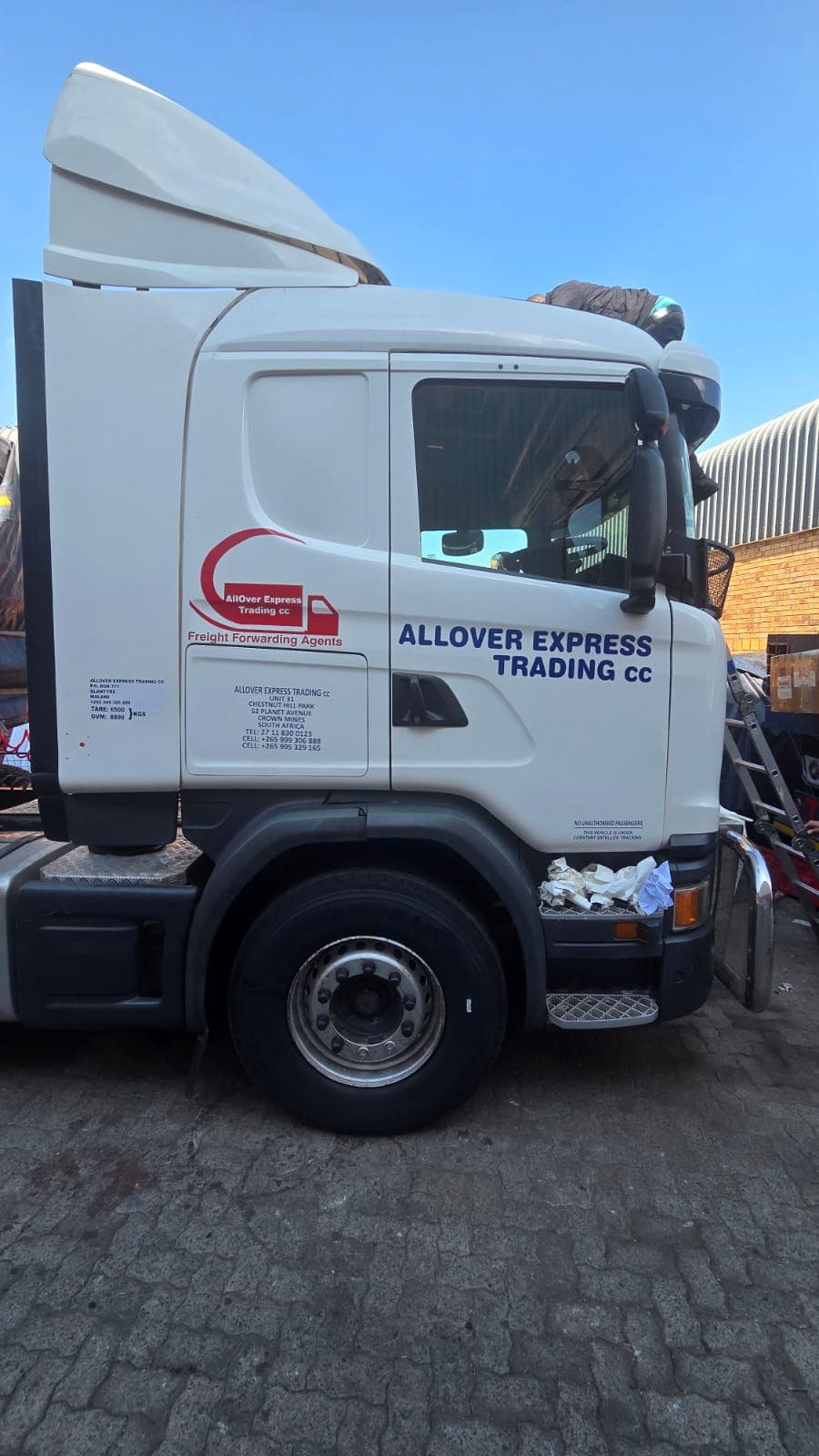 Truck cab with freshly applied company lettering and decals