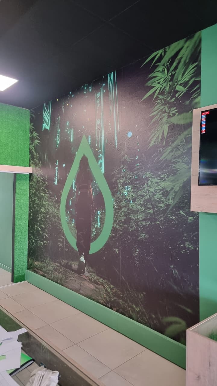 Full-wall printed jungle mural installed inside a retail store